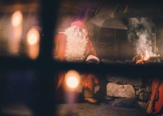 Santa-Claus-by-fireplace-in-Rovaniemi-Lapland-Finland.jpg